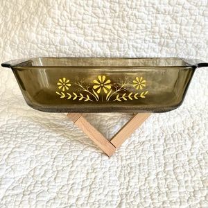 Vintage glass casserole dish with yellow flowers
